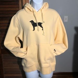 Small Black dog yellow hoodie